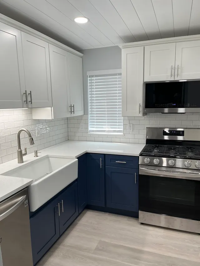 Blue shaker with white shaker — a kitchen supplied by Mr. Kitchen Cabinet