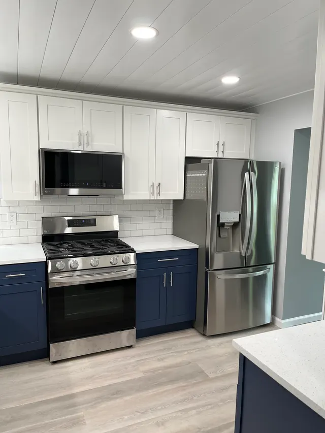 Blue shaker with white shaker — a kitchen supplied by Mr. Kitchen Cabinet